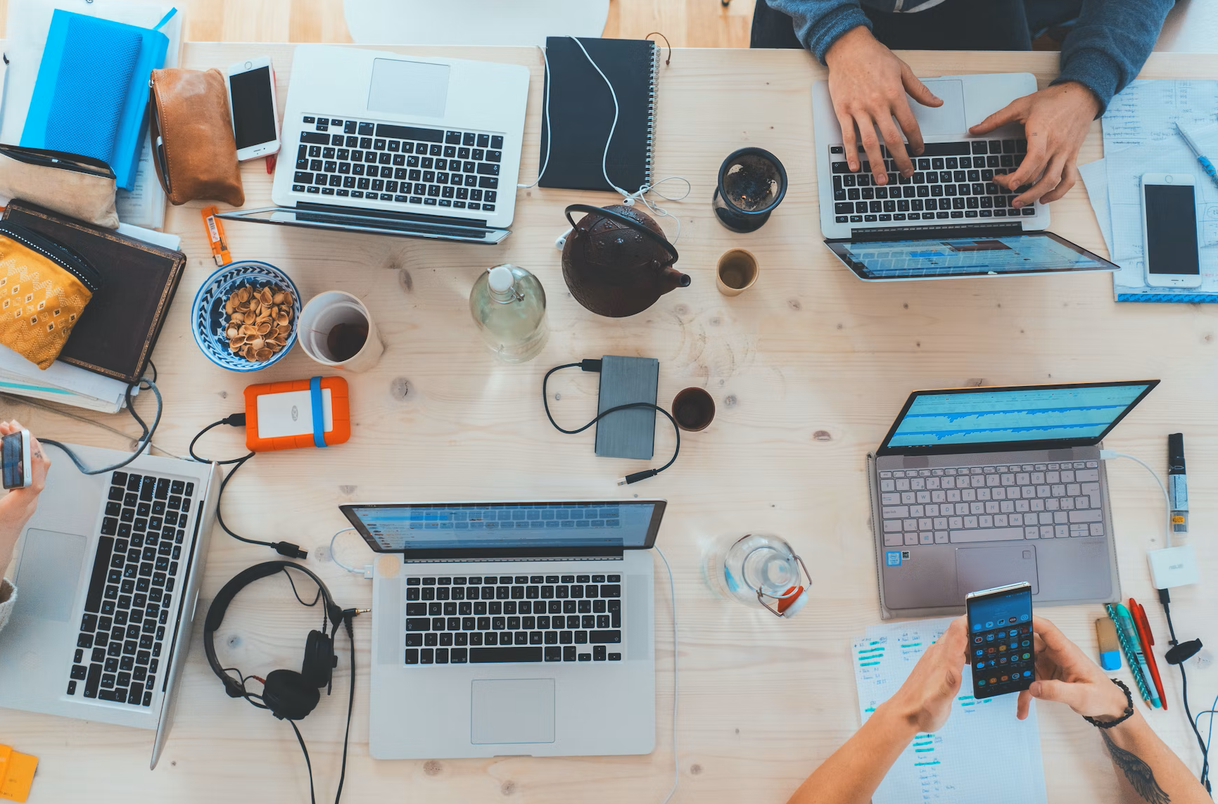 People using laptops on a desk