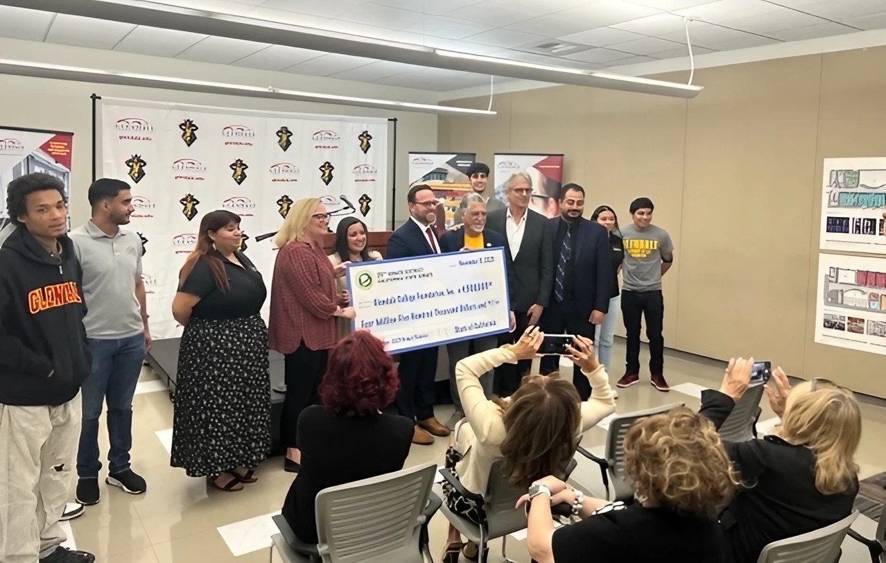 Students being presented with check