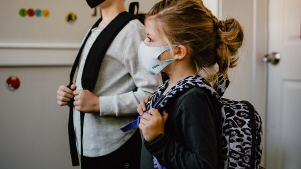 Child wearing a mask at school.